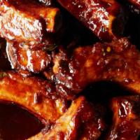 6 Pieces Bbq Fried Ribs ( Tips And Ribs)With 2 Sides · Tender spare ribs fried and tossed in BBQ sauce.