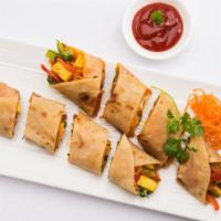 Egg & Paneer (Indian Cheese) On A Roll · Fresh eggs marinated with indian spices and Paneer (Indian cheese) stuffed inside fresh Indi...