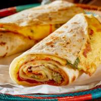 Egg On A Roll · Fresh eggs marinated with indian spices stuffed inside fresh Indian Bread.