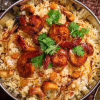 The Shrimp Biryani · An exotic blend of basmati rice, large prawns and traditional spices and herbs.
