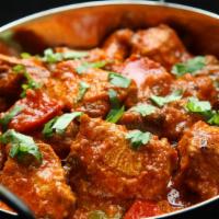 The Chicken Karahi · Spicy & flavorful dish made with chicken, onions, tomatoes, ginger, garlic & fresh ground sp...