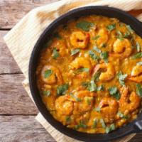 The Shrimp Curry · Large prawns with tomatoes and onions cooked with spices for a rich, hearty dish.