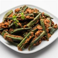 The Bhindi Masala · Farmers market fresh Okra marinated with onions, tomatoes, and Indian spices.