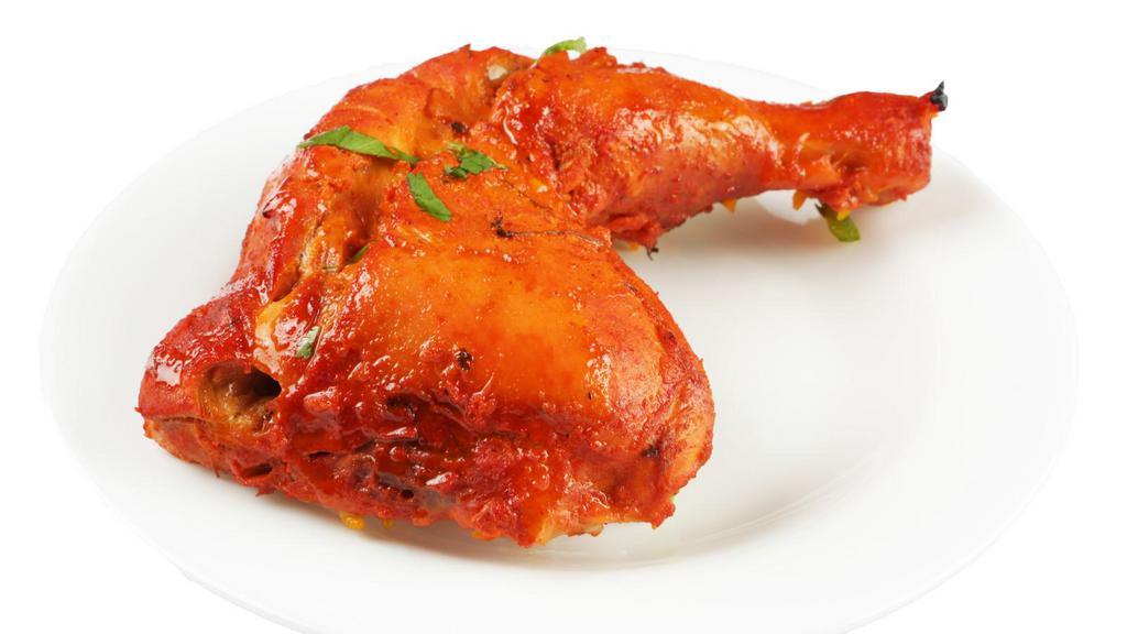 Chicken Tandoori · Chicken leg quarter marinated with traditional spices and yogurt then grilled to perfection.