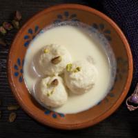 Ras Malai · Sweet round cottage cheese balls soaked in milk.