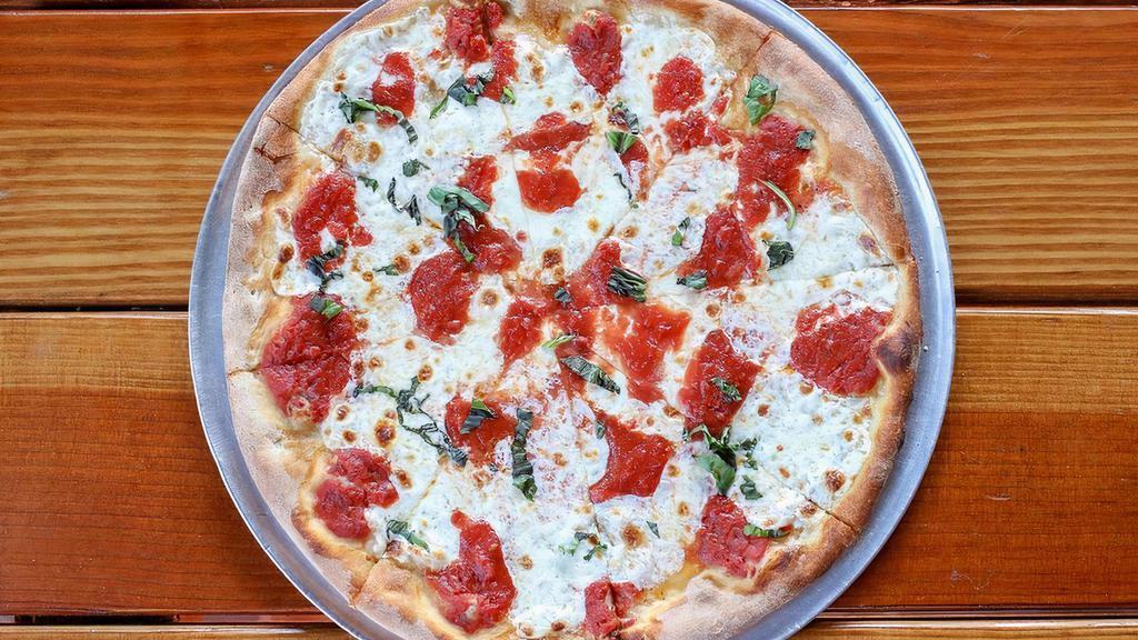 The Margherita · House made mozzarella, San Marzano tomatoes, basil and extra virgin olive oil.