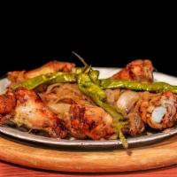 Tommy'S Coal Oven Roasted Wings · Topped with Coal fired roasted onions and an Italian long hot pepper. 10pc. Add Rosemary foc...