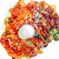 Loaded Nachos · Topped with your choice of meat, Cheddar Jack, jalapeños, black olives, pico de gallo, and s...