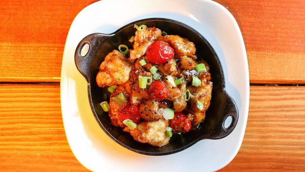 General Tso'S Cauliflower · Lightly battered and fried cauliflower, peppadew peppers, tossed in general tso's sauce and garnished with green onions.