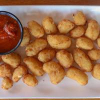 Breaded Wisconsin Cheese Curds  · With marinara sauce.