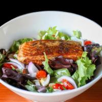 Grilled Salmon Salad: · Grilled blackened salmon, hard boiled eggs, red onion, roasted tomatoes, slivered almonds, o...