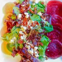 Sliced Beet Salad · Mixed greens, red and yellow beets, pecans, and goat cheese with white balsamic dressing.