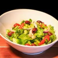 Tommy'S House Salad  · Romaine, red onions, cherry tomatoes, chickpeas, celery, and Kalamata olives with house dres...