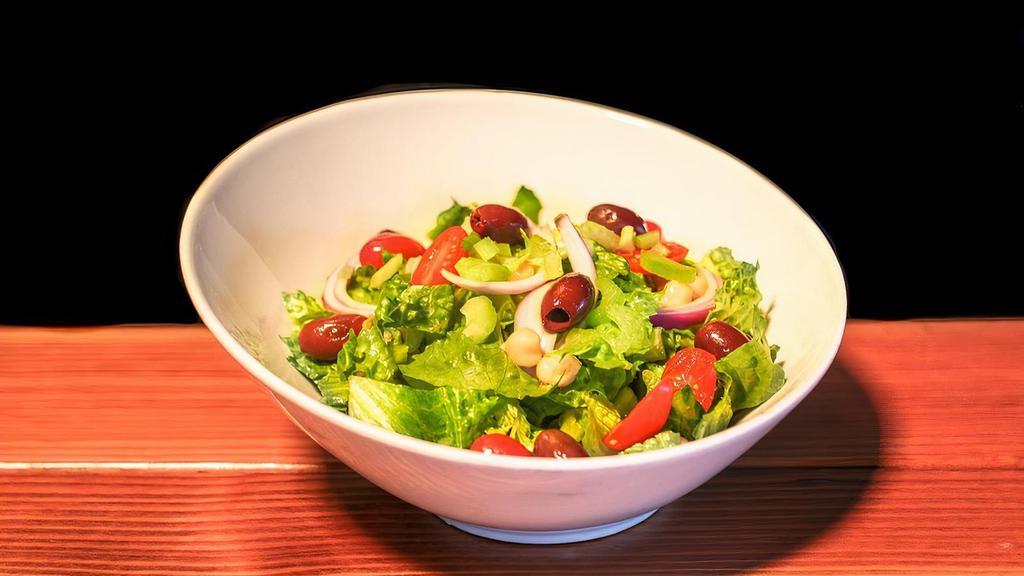 Tommy'S House Salad  · Romaine, red onions, cherry tomatoes, chickpeas, celery, and Kalamata olives with house dressing.