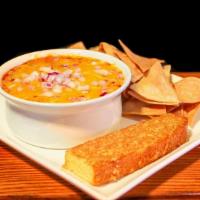 Crock Of Chili  · With Cheddar Jack and red onion. Made from scratch daily.