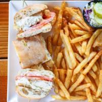 Crispy Buttermilk Chicken Sandwich · hand battered chicken tenders, chipotle mayo, pepper Jack cheese, sliced tomato and apple sl...