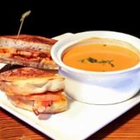 Grilled Cheese Classic With Tomato Basil Soup · Sharp Cheddar, bacon, and tomato on country bread with tomato basil soup.