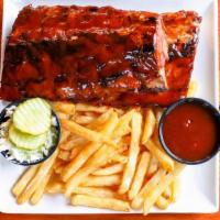 Cherry Coke Bbq Ribs · Full rack of baby back ribs slow roasted with a cherry coke BBQ sauce served with fries and ...