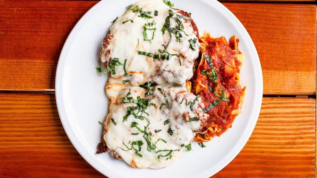 Chicken Parmigiana  · Two hand breaded chicken cutlets topped with homemade marinara sauce and mozzarella served with pappardelle pasta.