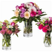 Mixed Seasonal Flower Arrangement · Seasonal Mixed Flowers designed in a seasonal vase.