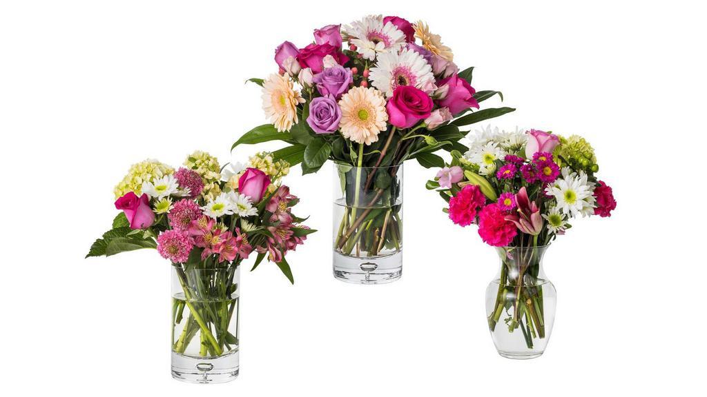 Mixed Seasonal Flower Arrangement · Seasonal Mixed Flowers designed in a seasonal vase.