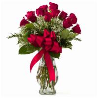 Debi Lilly Unforgettable Arrangement · Includes 12 stems of premium Ecuadorian roses and filler arranged in an hourglass vase with ...