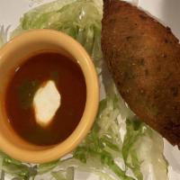 Chile Poblano · 2 Poblano peppers stuffed with shredded chicken, onions, corn, peppers topped with a Mexican...