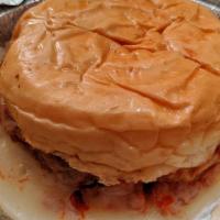 Pizza Burger · Topped with melted mozzarella cheese and tomato sauce.