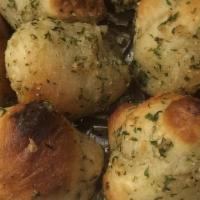 Garlic Knots · Four pieces. Side of sauce