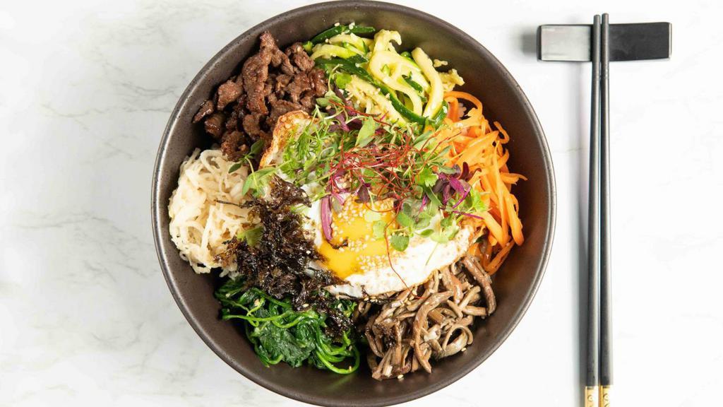 Bibim Bap · Sauteed and seasoned vegetables mix with rice. Served with a fried egg on top and house spicy gochujang sauce on the side.