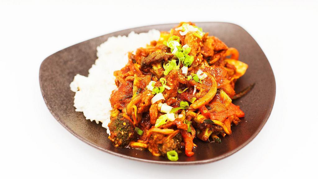 Jeyook Dup Bap · Jeyook (spicy marinated pork) and vegetables over rice.