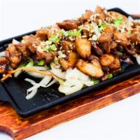 Soy Dak Bokum · Stir-fried chicken thighs marinated in Silver Factory soy garlic sauce. Served with a bowl o...