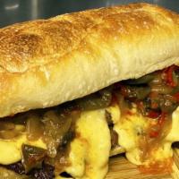 Vegan Philly Cheesesteak Sub · Vegan. Sliced seitan, sautéed peppers and onions and cheese sauce on a toasted long roll.