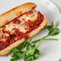 Meatball Parm Sub · Vegan. Freakin' vegan meatballs on a toasty long roll, smothered in our tomato sauce with me...