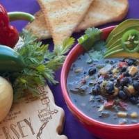 Bad To The Bean · Vegan & gluten free - rich, filling black bean soup topped with cilantro & avocado