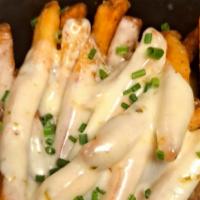 Cheesy Fries · These fries are as cheesy as we are.  With House Seasoning and topped with chives