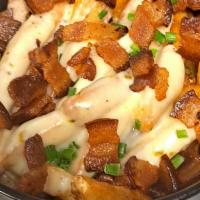 Piggy Fries · House Seasoned Fries with your choice of cheese & bacon - topped with Chives