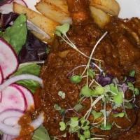 Raan –E- Gosht · Braised lamb shank, simmered in onion, garlic roasted spices.