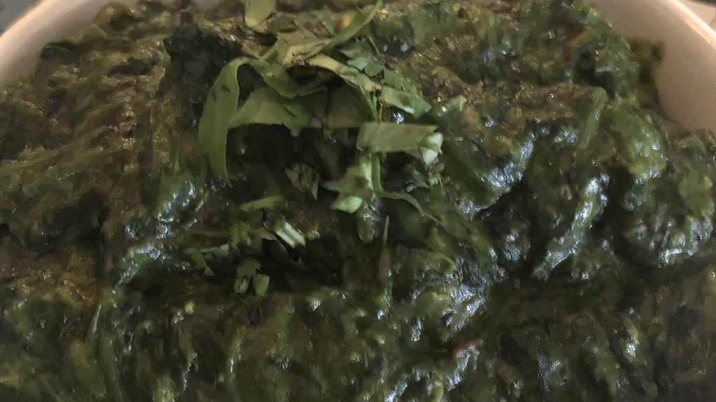 Saag Paneer · Feshly cooked spinach with indian cheese.
