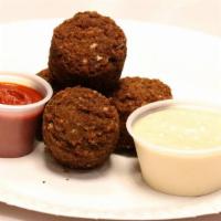4 Pcs Of Falafel · 4Pcs of Home Made Falafel With Traditional white Sauce And Hot Sauce On Side