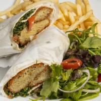Falafel · Vegetarian. Falafel wrapped in freshly baked pita bread with tahini, tabouli, pickles and fr...
