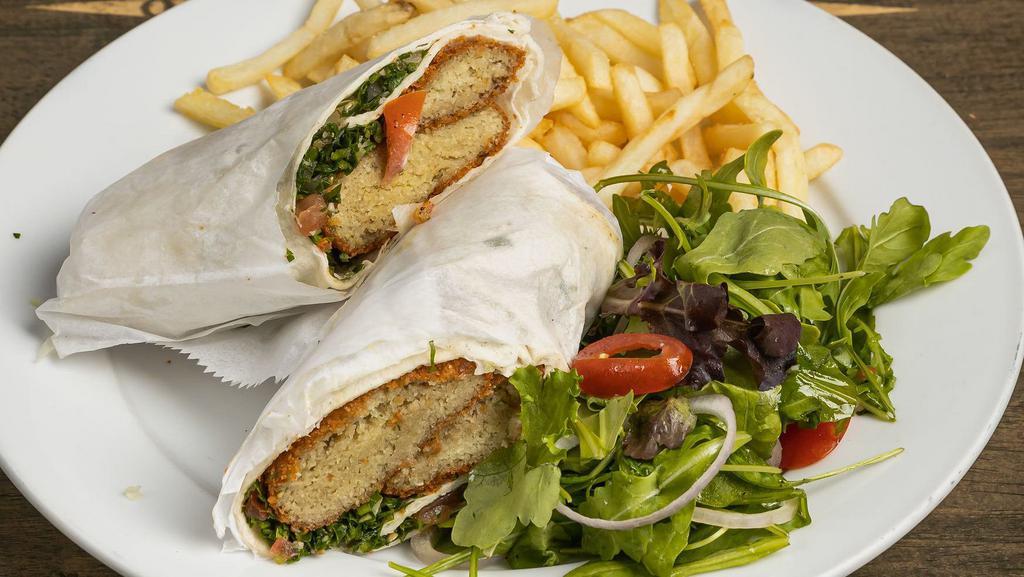 Falafel · Vegetarian. Falafel wrapped in freshly baked pita bread with tahini, tabouli, pickles and fries.
