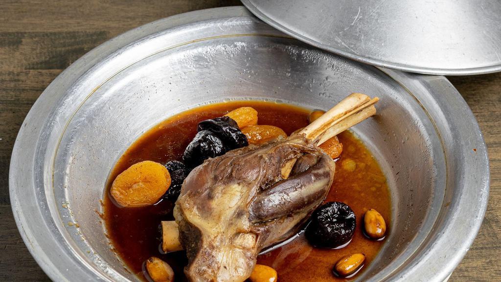 Lamb Tajine · Gluten-free, chef recommendation. Traditional Moroccan slow cooked lamb shanks with caramelized prunes and almonds served with basmati rice.
