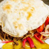 Beef Shawarma · Chef recommendation. Strips of marinated organic ribeye roasted & w/ tahini sauce and onion ...