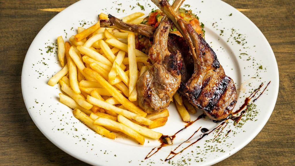 Lamb Chops · Gluten-free, chef recommendation. Grilled lamb chops served, French fries and chopped salad.