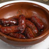 Makanek · Gluten-free. Fresh Lebanese sausage sauteed with pomegranate molasses and served with fries.