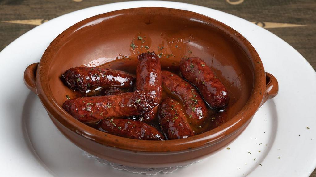 Makanek · Gluten-free. Fresh Lebanese sausage sauteed with pomegranate molasses and served with fries.