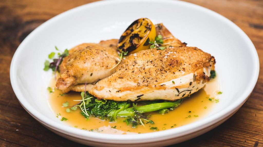Brick Half Chicken · with broccoli rabe, charred lemon, and thyme jus