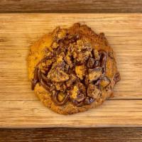 The Nutty Professor · Crushed Resse's Peanut Butter cup cookie base w' Nutella & crushed Resse's