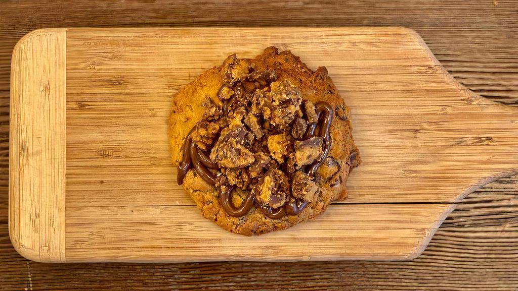The Nutty Professor · Crushed Resse's Peanut Butter cup cookie base w' Nutella & crushed Resse's